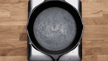 Checking the temperature of a cast-iron pan